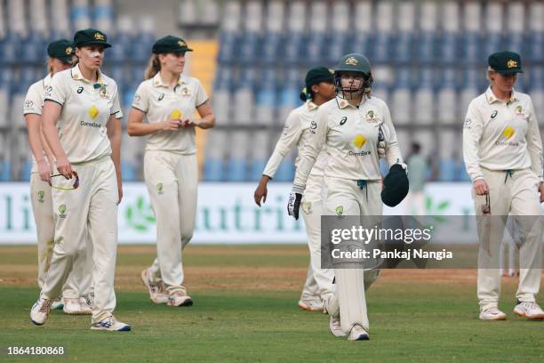 Players of Australia walks back at end of day one of the Women's Test Match between India and Australia at Wankhede Stadium on December 21, 2023 in...