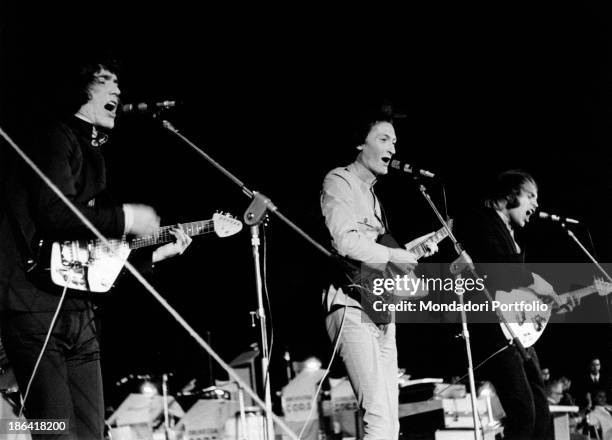Portrait of three members of the Italian band Equipe 84 while the are singing the song Io ho in mente te, winner of Cantagiro 1966: from the left,...