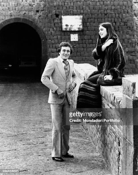The young couple of artists Al Bano, born Albano Carrisi and Romina Power in front of the entrance gate of Castel dell'Ovo, an ancient castle located...