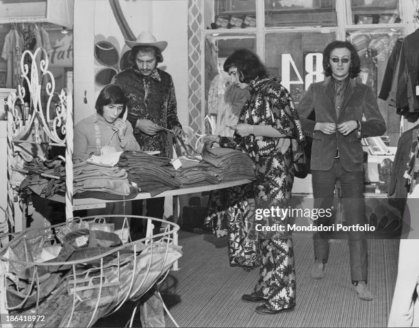 The Equipe 84 band in the grocery store of Solferino street. They bought the grocery store and have it turned into a clothing store. Milan , 1967.