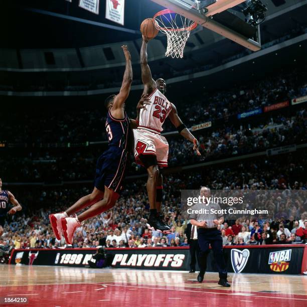 Michael Jordan of the Chicago Bulls goes for a dunk against the New Jersey Nets during Game One, round one of the 1998 NBA Playoffs at the United...