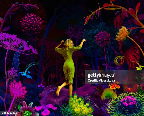 young woman in action in surreal night jungle - crazy holiday models stock pictures, royalty-free photos & images