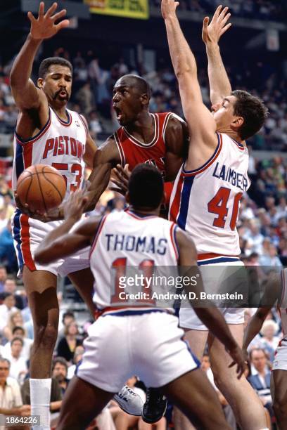 Michael Jordan of the Chicago Bulls drives to basket against the Detroit Pistons during the 1989 season NBA game in Detroit, Michigan. NOTE TO USER:...