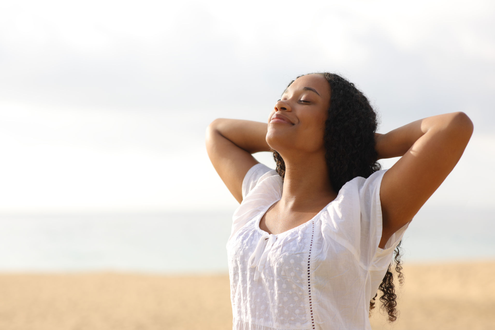Black woman resting breathing on the beach Black woman resting breathing on the beach