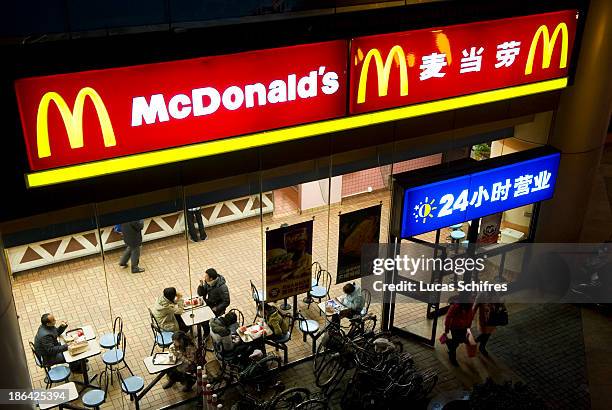 Clients exist a McDonald's fast food restaurant at night in Shanghai, China, on February 18, 2011.