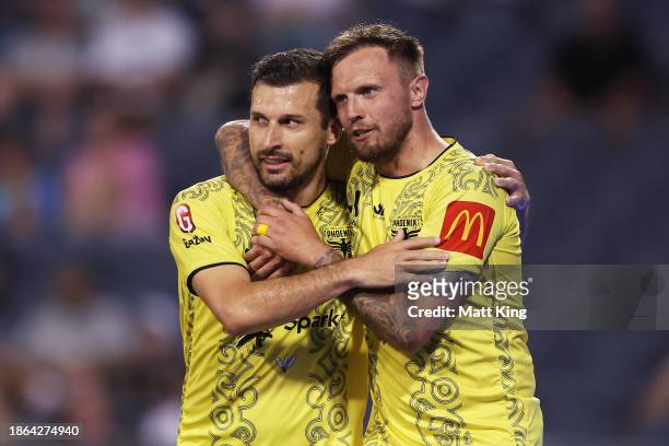 Konstantinos Barbarouses of the Phoenix celebrates with team mate David Ball of the Phoenix after scoring his first goal during the A-League Men...