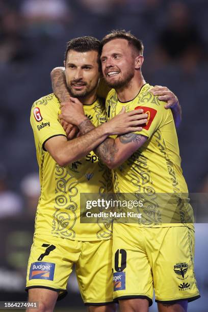 Konstantinos Barbarouses of the Phoenix celebrates with team mate David Ball of the Phoenix after scoring his first goal during the A-League Men...