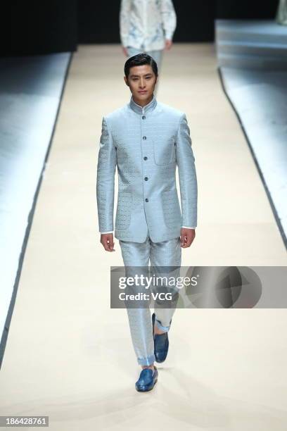 Model showcases designs by Zeng Fengfei on the runway at the Zeng Fengfei Men's Collection show during Mercedes-Benz China Fashion Week Spring/Summer...