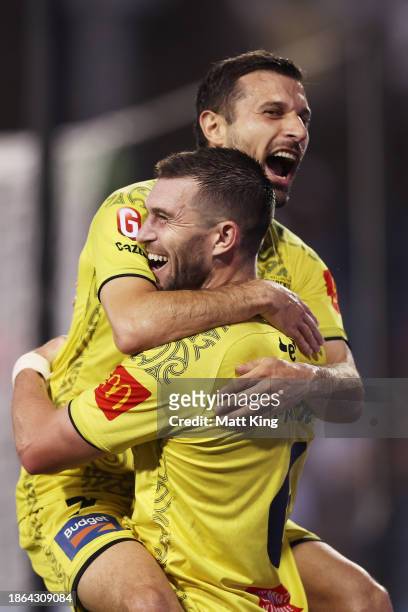 Konstantinos Barbarouses of the Phoenix celebrates with team mate Timothy Payne of the Phoenix after scoring his second goal during the A-League Men...