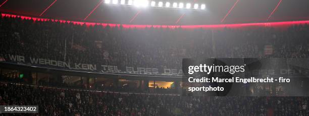 Fans of VfB Stuttgart with banner protest against investors in the DFL ahead of the Bundesliga match between FC Bayern München and VfB Stuttgart at...