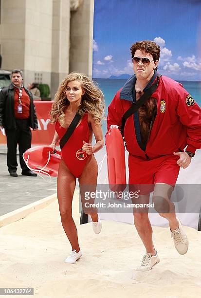 Carmen Electra and Willie Geist attend NBC's "Today" Halloween 2013 in Rockefeller Plaza on October 31, 2013 in New York City.