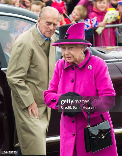 Queen Elizabeth II and Prince Philip, Duke of Edinburgh visit West Quay Fisheries, Newhaven Fish Market on October 31, 2013 in Newhaven, England.