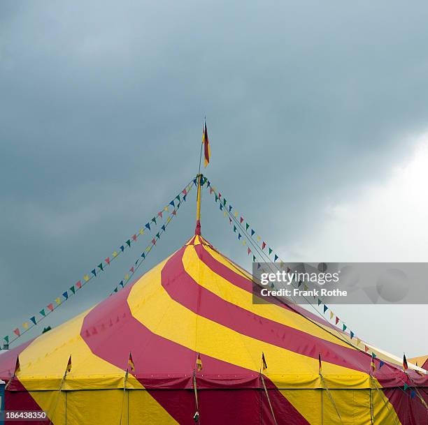 circus with colorful flags and pennants - circus stock-fotos und bilder