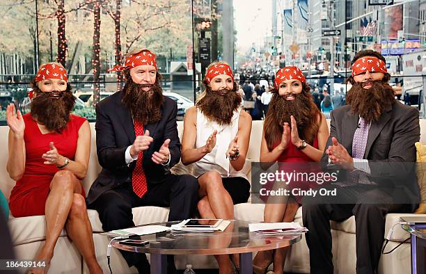 Hosts Heather Childers, Steve Doocy, Elisabeth Hasselbeck, Brian Kilmeade and Maria Molina wear 'Duck Dynasty' costumes as "FOX & Friends" celebrates...