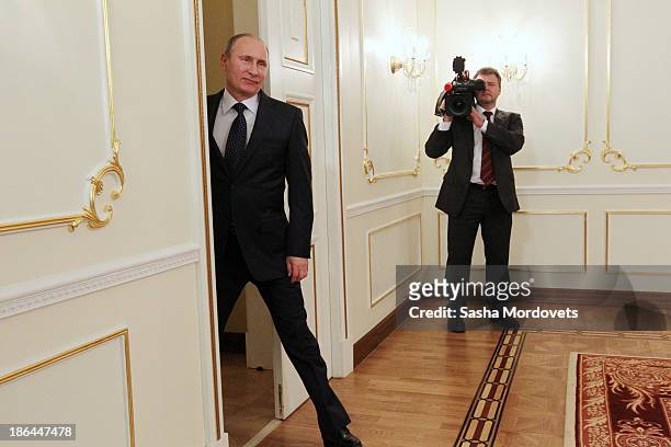 Russian President Vladimir Putin arrives at a meeting with the winners of the 2013 World Combat Games October 31, 2013 in Moscow, Russia. The Russian...