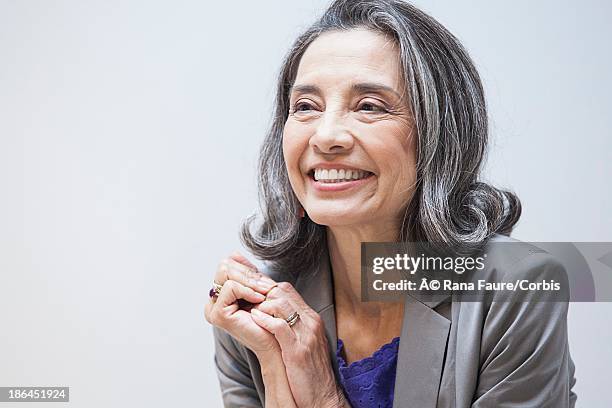 portrait of middle-aged businesswoman - studio portrait of mature woman stock pictures, royalty-free photos & images