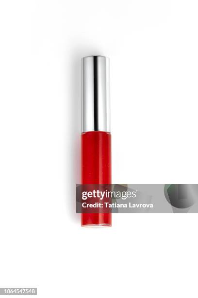 rich red lip gloss isolated on white colored background. beauty industry and cosmetics with copy space for text, design elements, logo. makeup and skin care products. - brillant à lèvres photos et images de collection