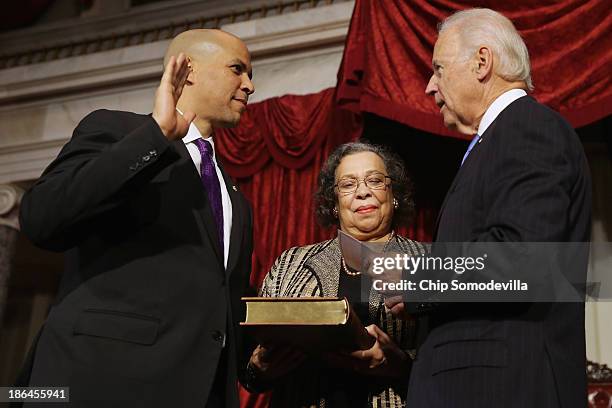 Vice President Joe Biden administers a ceremonial swearing for Sen. Cory Booker as his mother Carolyn Booker holds a Bible in the Old Senate Chamber...