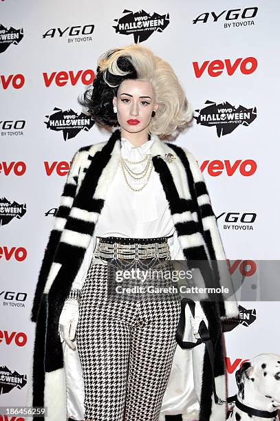 Iggy Azalea dressed as Cruella de Vil attends the VEVO Halloween showcase at The Oval Space on October 31, 2013 in London, England.