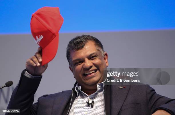 Tony Fernandes, chief executive officer of AirAsia Bhd., raises his cap during the 9th World Islamic Economic Forum in London, U.K., on Thursday,...