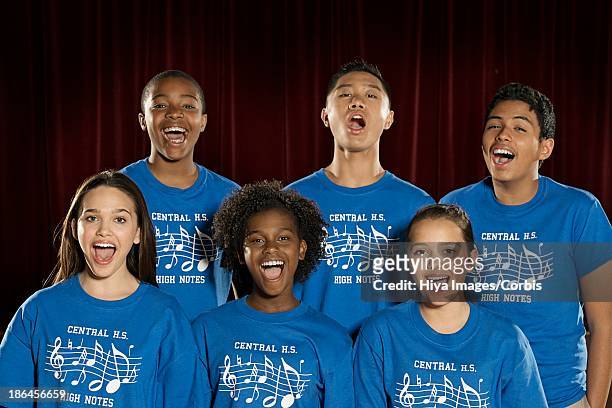 teenage boys and girls (16-17) singing in choir - choir ストックフォトと画像