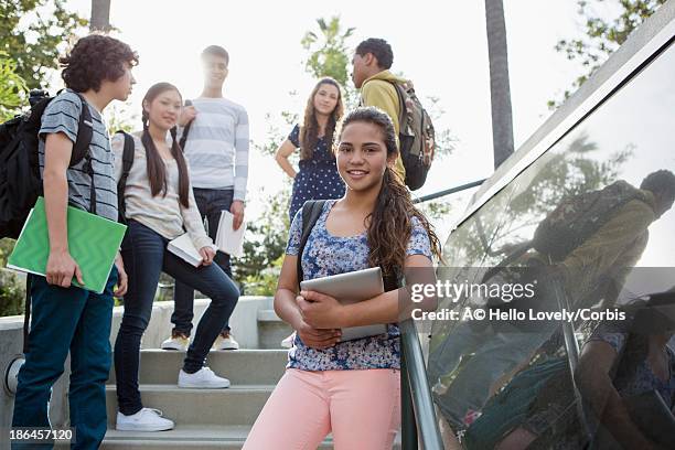 teenagers (13-15) standing on steps - adolescent africain stock pictures, royalty-free photos & images