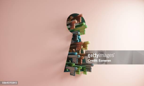giant keyhole with variety of keys - unlocking stock pictures, royalty-free photos & images