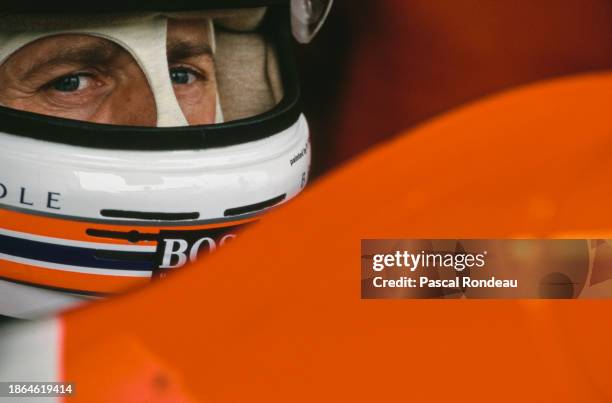 Martin Brundle from Great Britain looks out from the cockpit of the Marlboro McLaren Peugeot McLaren MP4-9 Peugeot V10 during practice for the...