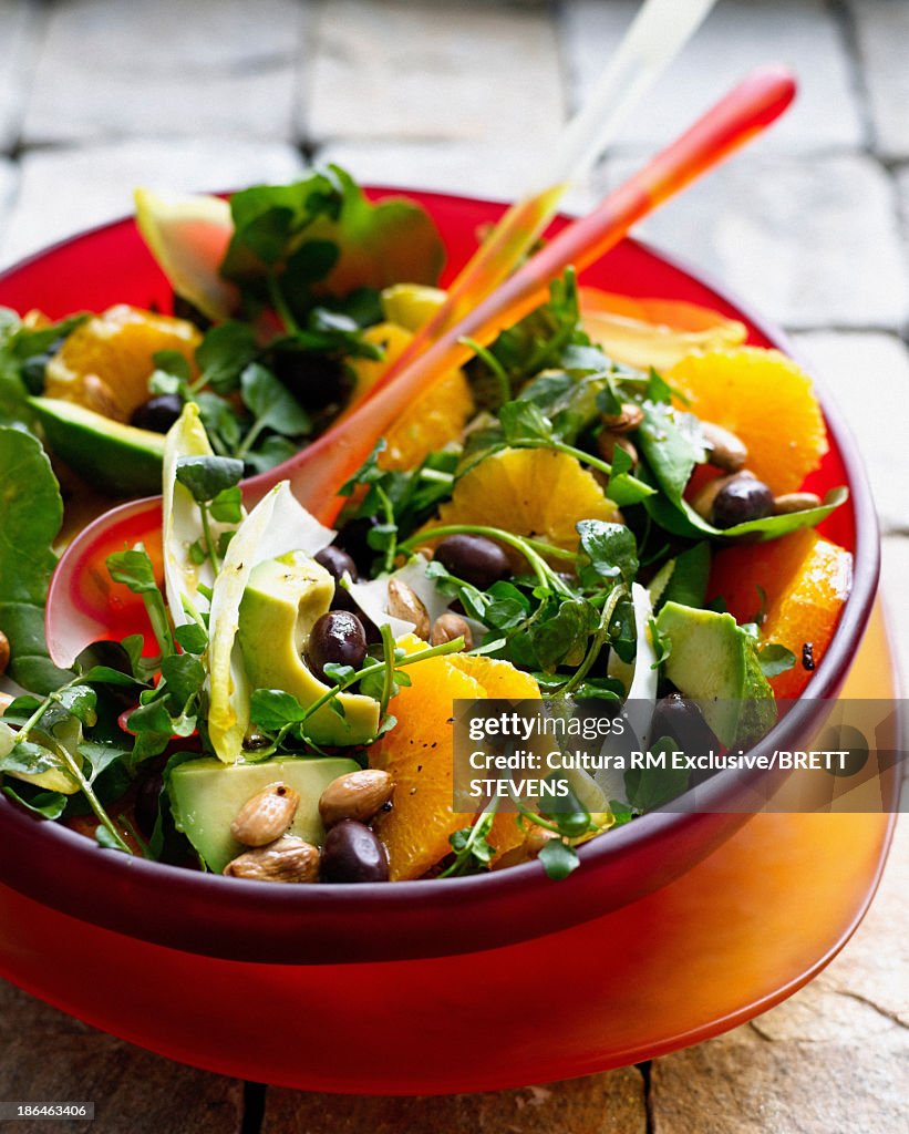 Bowl of watercress salad with orange and almonds