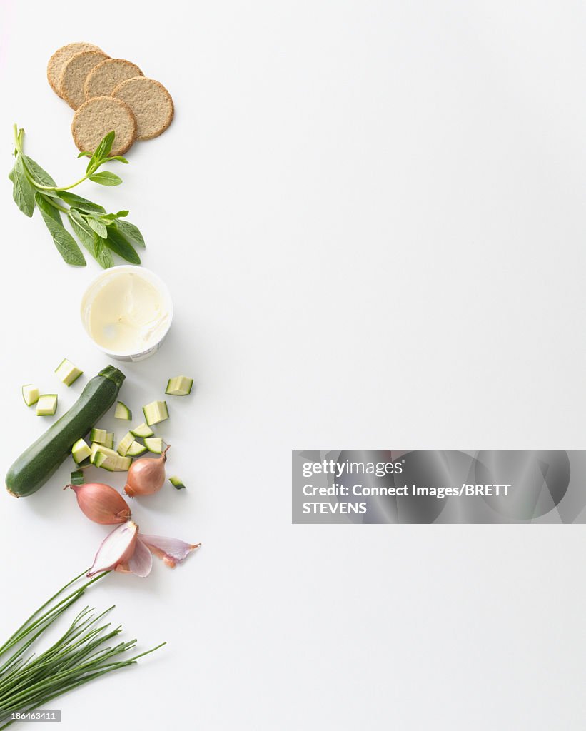 Still life food selection of zucchini, cream and digestive biscuits