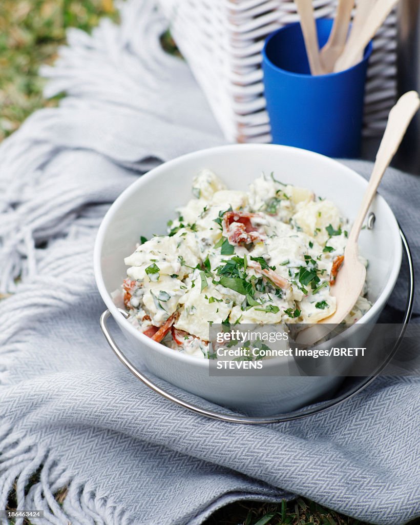 Bowl of potato salad with bacon