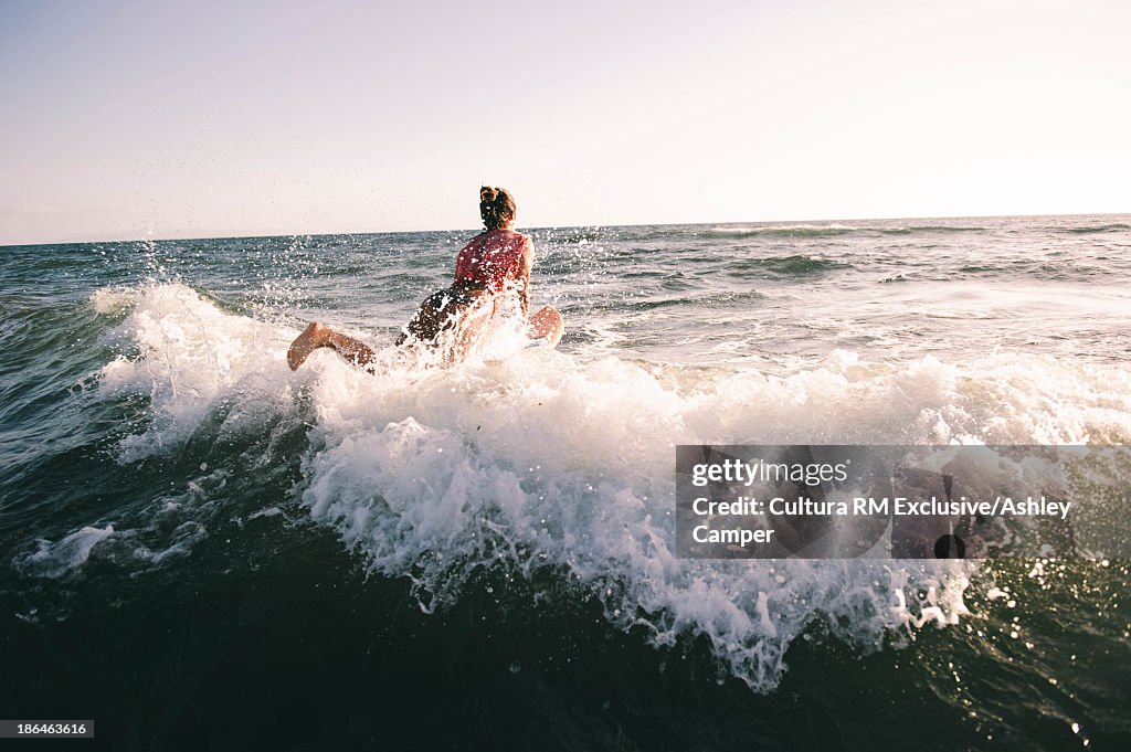 Woman on surfboard in water