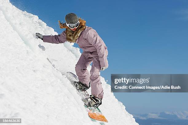 woman snowboarding downhill, are, sweden - women snowboarding stock pictures, royalty-free photos & images