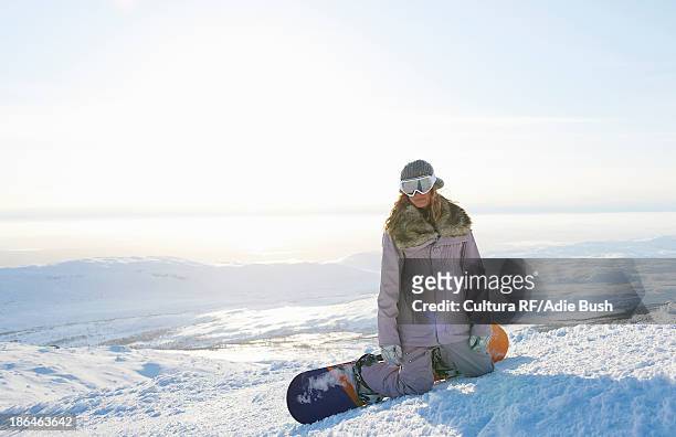 snowboarder kneeling in snow, are, sweden - sweden snowboarding stock pictures, royalty-free photos & images