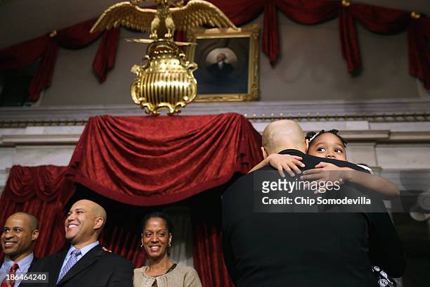 Sen. Cory Booker holds his nerice Zelah Booker after his ceremonial swearing-in in the Old Senate Chamber at the U.S. Capitol October 31, 2013 in...
