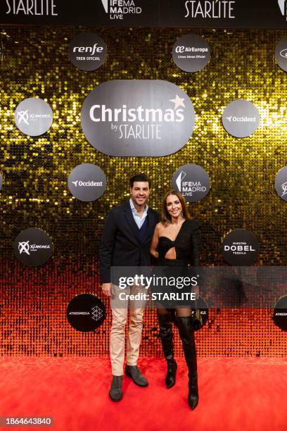 Miguel Torres and Paula Echevarria attend to the photocall ahead of the concert of Manuel Turizo during the "Christmas By Starlite" 2023 at Ifema on...