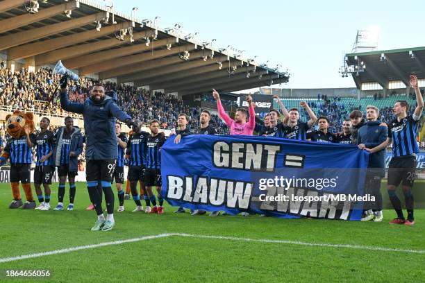 Players of Brugge celebrate with the banner Gent = Blauw - Zwart after winning the Jupiler Pro League season 2023 - 2024 match day 18 between Club...