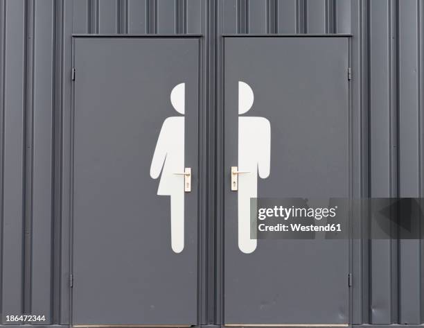 germany, male and female sign on toilet door - nicht binäres geschlecht stock-fotos und bilder