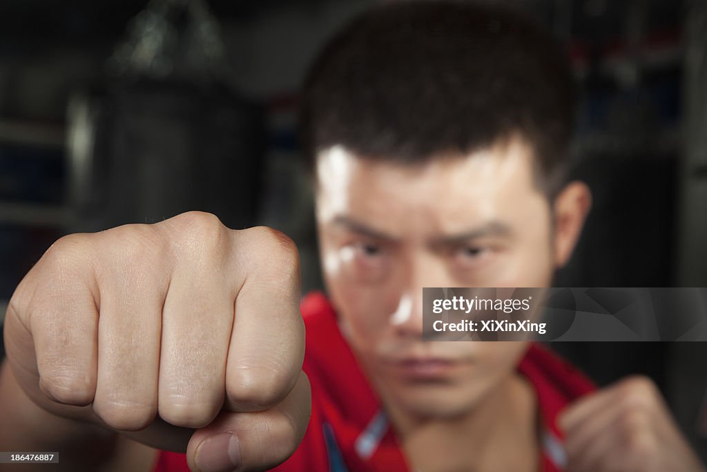 Close up of boxer throwing a punch at the camera