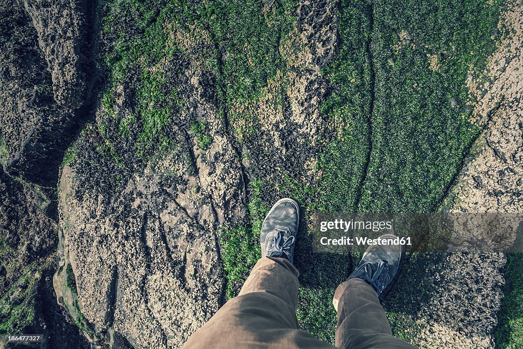 Spain, Man standing on rock