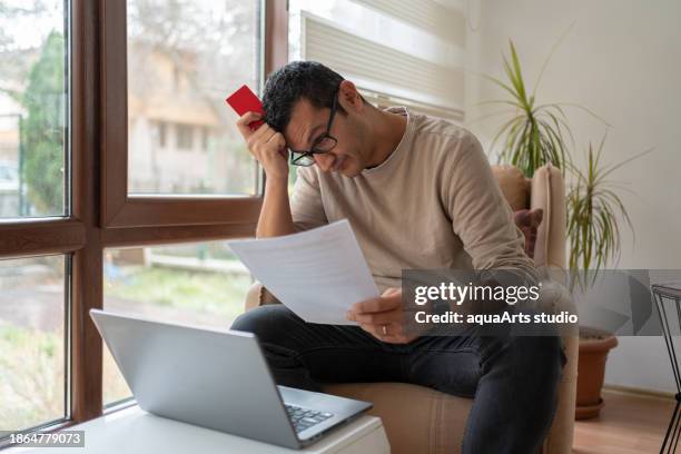 unhappy man feel worry about financial problems at home - restrictions stock pictures, royalty-free photos & images