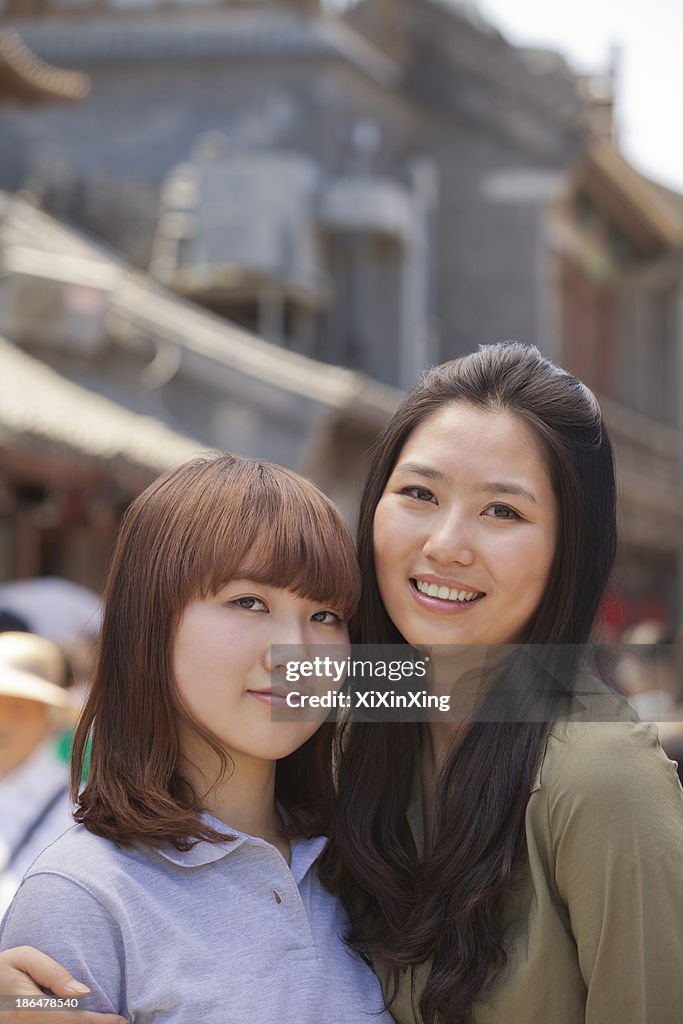 Portrait of two young girls in Beijing outdoors