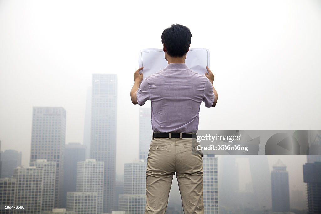 Mid Adult Man In Front Of Cityscape