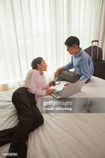 business couple in hotel room - confort at hotel bedroom ストックフォトと画像