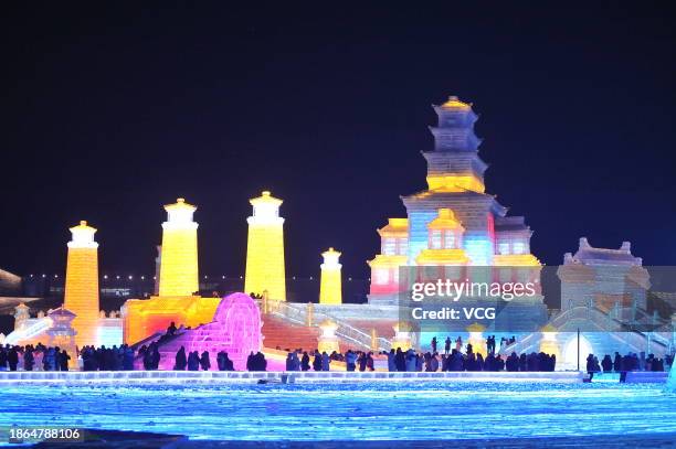 Aerial view of tourists viewing colorful ice sculptures at the 25th Harbin Ice and Snow World on December 18, 2023 in Harbin, Heilongjiang Province...