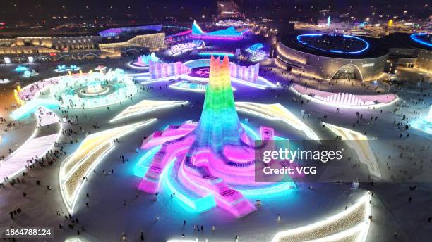 Aerial view of tourists viewing colorful ice sculptures at the 25th Harbin Ice and Snow World on December 18, 2023 in Harbin, Heilongjiang Province...