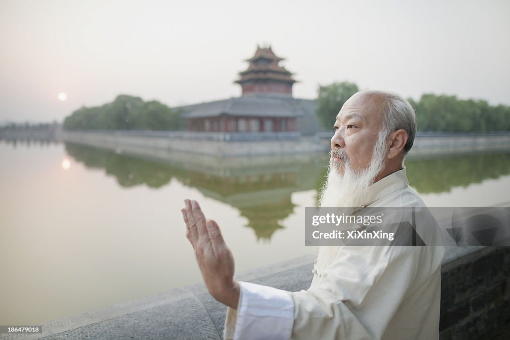 Senior Man Practicing Tai Ji