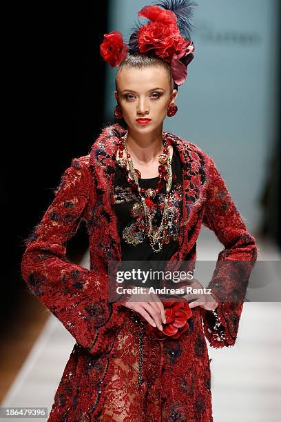 Model walks the runway at the SLAVA ZAITSEV Haute Couture show during Mercedes-Benz Fashion Week Russia S/S 2014 on October 31, 2013 in Moscow,...