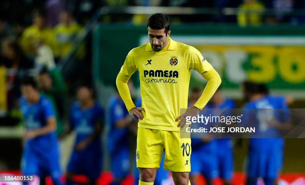 Villarreal's midfielder Cani reacts after Getafe scored during the Spanish league football match Villarreal CF vs Getafe CF at El Madrigal stadium in...
