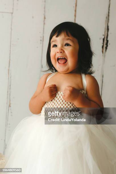 toddler girl wearing fancy gown - toddler girl dress stock pictures, royalty-free photos & images